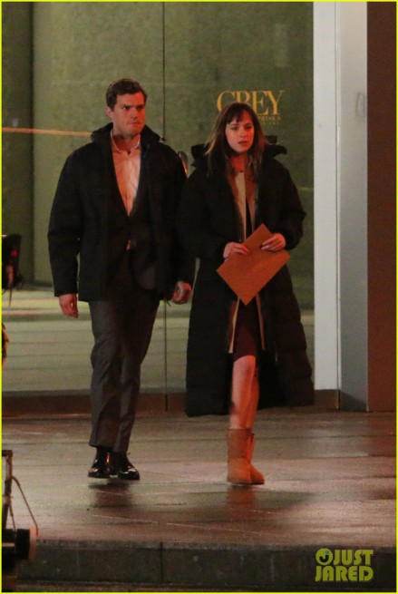 Jamie Dornan and Dakota Johnson rehearse scenes and go over the script with director Sam Taylor Johnson outside of Grey Enterprises before shooting in the freezing temperatures for 'Fifty Shades Of Grey' in Vancouve